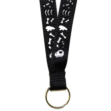 Load image into Gallery viewer, A close-up of the bottom of a lanyard, featuring a silver coloured split ring. The lanyard features cartoonish dinosaur bones printed on both sides. The lanyard is made from recycled PET plastic bottles.
